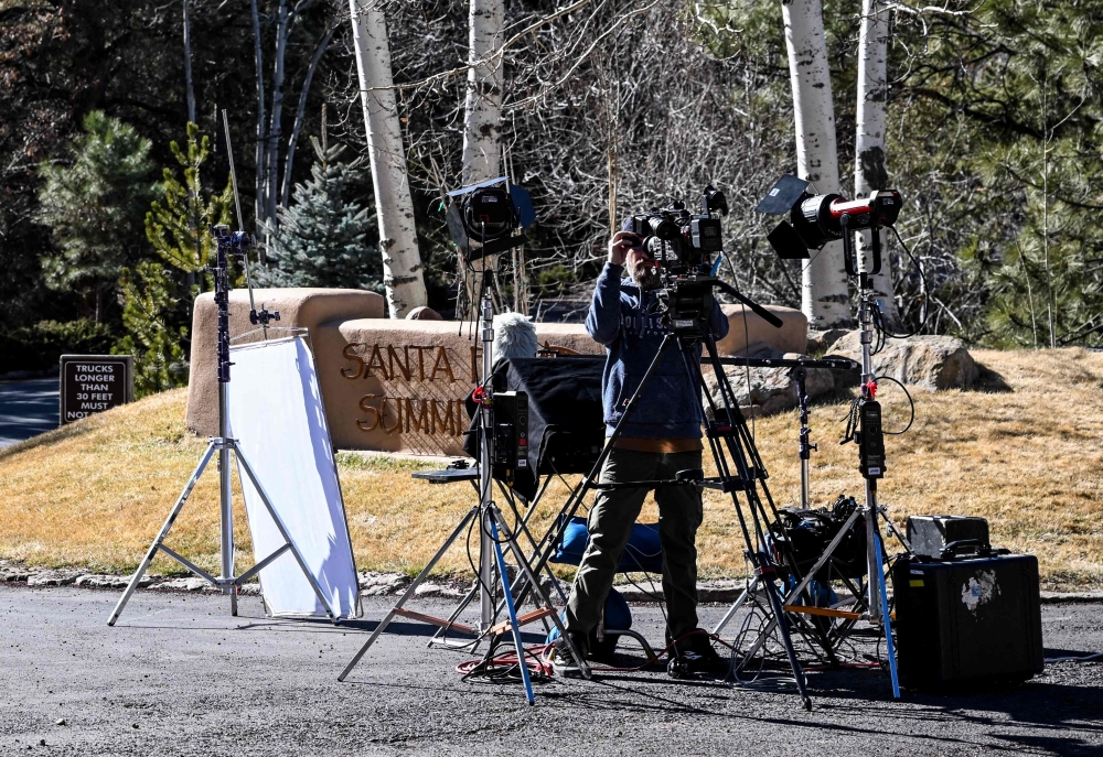A journalist sets up a camera at the entrance to the Santa Fe Summit neighborhood where late US actor Gene Hackman lived, in Santa Fe, New Mexico. — Pic by AFP 
