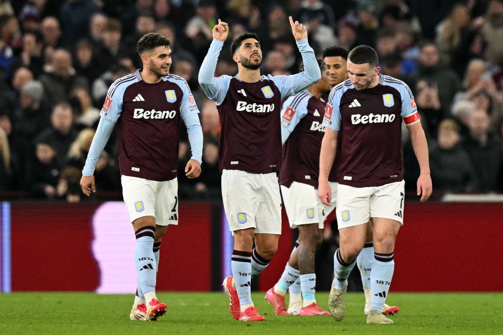 Aston Villa’s Marco Asensio (centre) celebrates scoring the team’s second goal during the English FA Cup fifth round against Cardiff City at Villa Park in Birmingham. — Pic by AFP