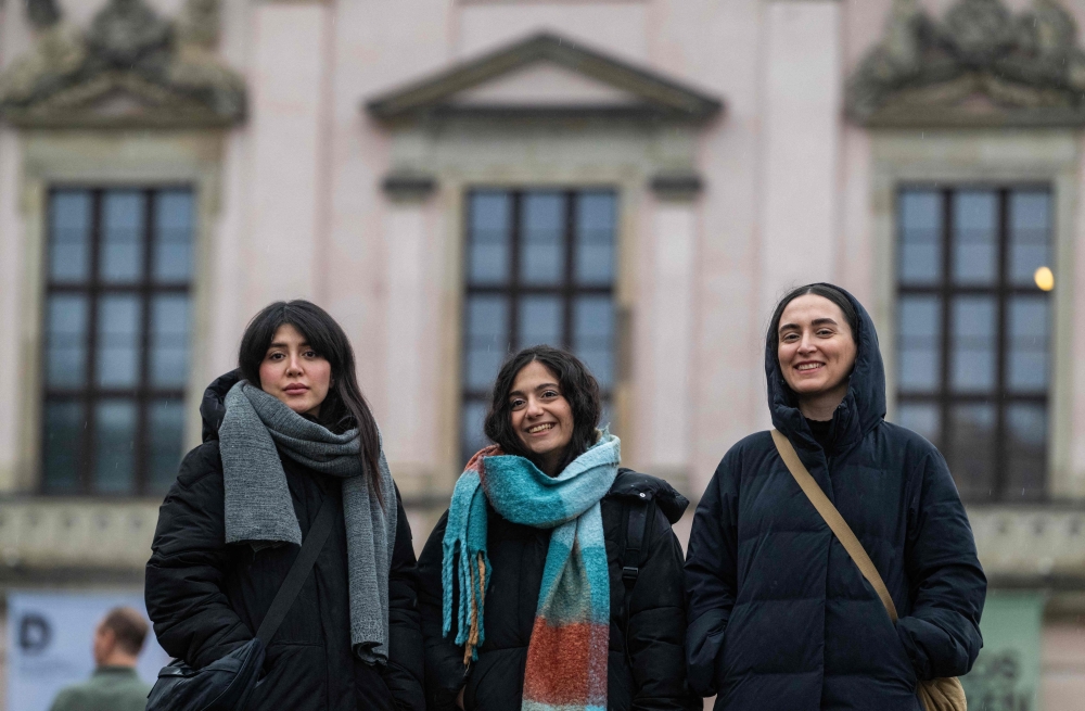 Iranian actresses (from left) Niousha Akhshi, Setareh Maleki, and Mahsa Rostami pose in front of the German History Museum on Unter den Linden avenue in Berlin after an AFP interview in Berlin on January 28, 2025. Iranian filmmaker Mohammad Rasoulof’s ‘The Seed of the Sacred Fig’ won a special prize at the Cannes film festival last year and is hoping to go one better at the 2025 edition of the Oscars. — AFP pic
