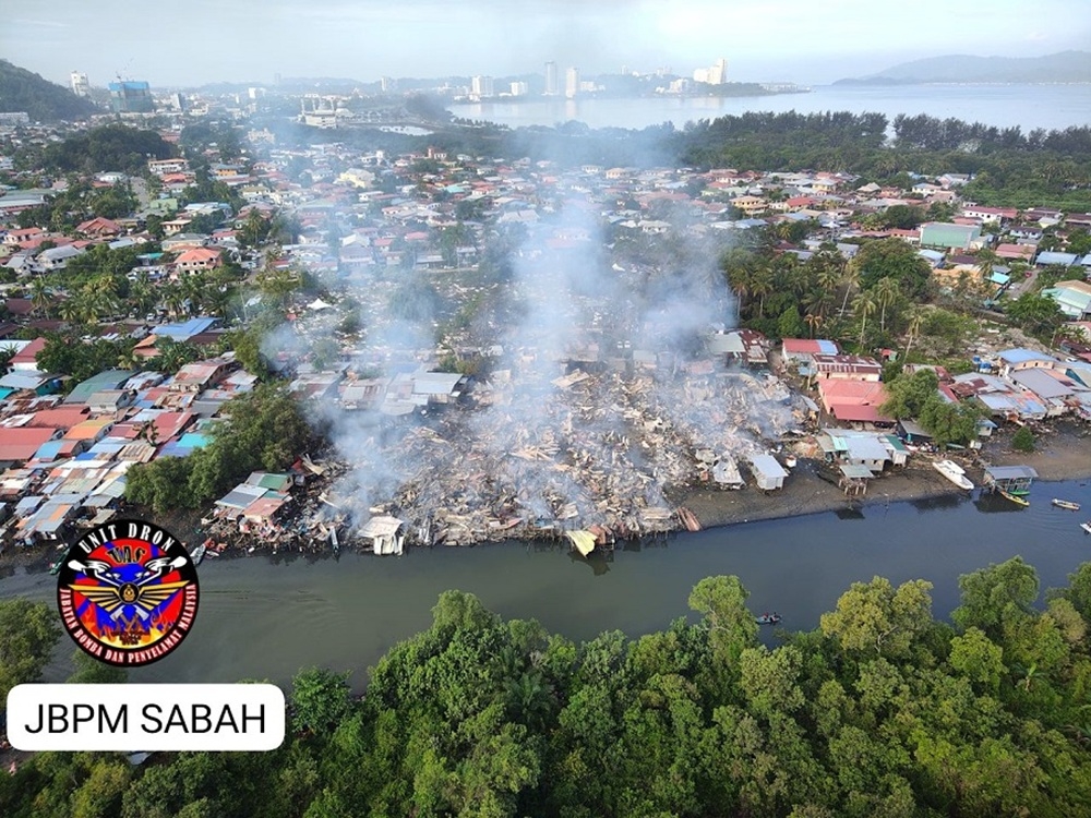 Early morning fire destroyed 80 houses in Kampung Cempaka, Likas. — Picture courtesy of the Fire and Rescue Department
