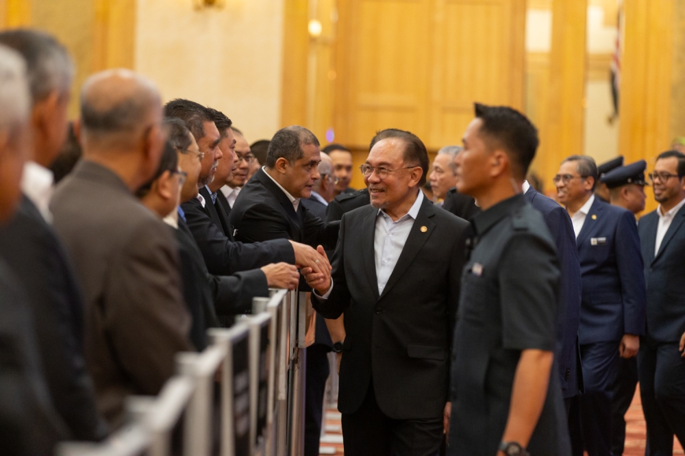 Prime Minister Datuk Seri Anwar Ibrahim greets attendees during the Prime Minister’s Department monthly assembly in Putrajaya. March 3,2025 — Picture By Raymond Manuel