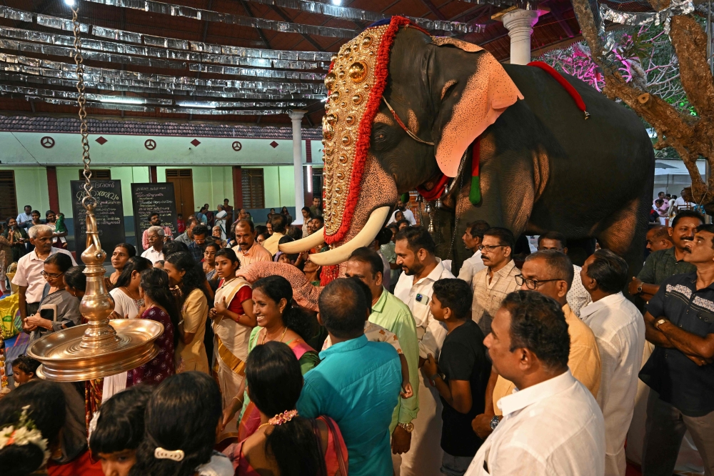It flaps its ears and squirts water from a waving trunk, but this elephant is a life-size mechanical replica rolled out to replace the endangered animals in India’s Hindu temples. — AFP pic