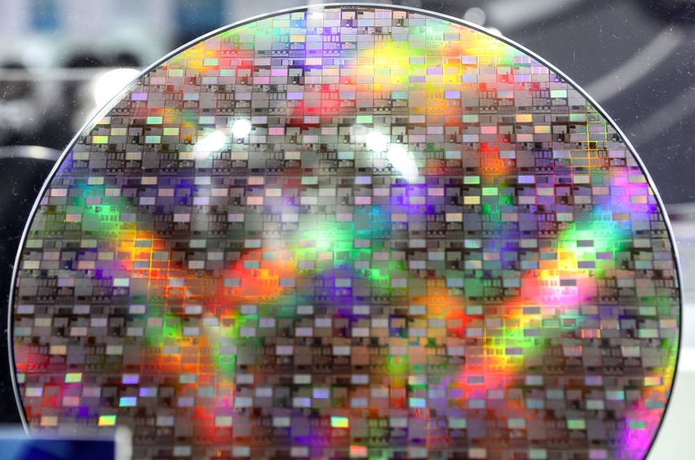 A sample of a wafer is seen at a semiconductor exhibition in Taipei, Taiwan where home manufacturer TSMC, currently dominates the global chip market. — AFP pic