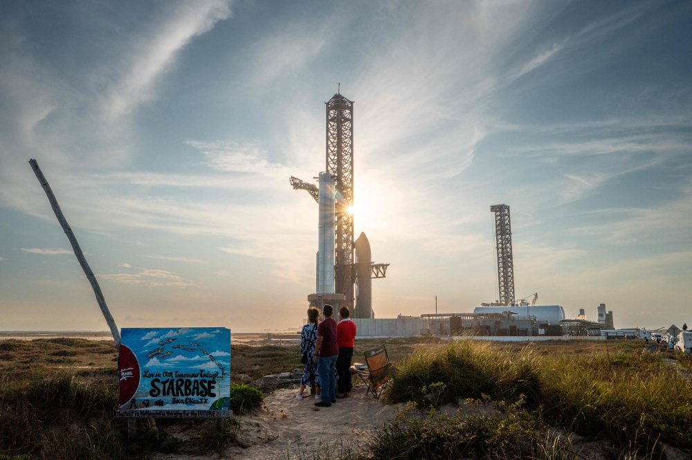 People watch SpaceX Starship Flight 8 as it is stationed near Orbital Launch Pad A ahead of launch at Boca Chica beach on March 03, 2025 in Boca Chica Beach, Texas. — AFP pic