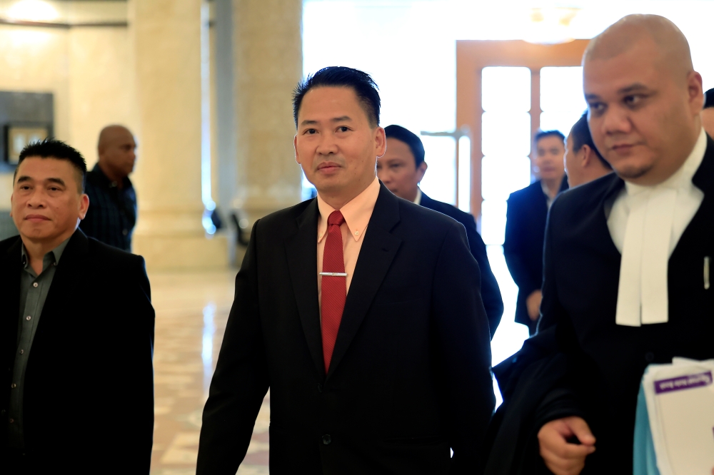 Former Sabah Infrastructure Development Minister Datuk Peter Anthony (centre) begins his three-year jail term and RM50,000 fine today after losing his final appeal against a conviction for falsifying documents related to a maintenance and service contract at Universiti Malaysia Sabah. — Bernama pic