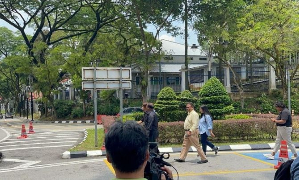 Six individuals, including three Era FM radio announcers, presented themselves at the Bukit Aman police headquarters here today to give their statements regarding a video that appeared to mock a religious ceremony. — Bernama pic