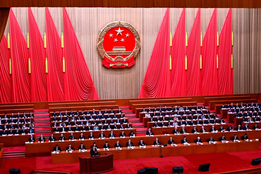 China’s Premier Li Qiang speaks during the opening session of the annual National People’s Congress at the Great Hall of the People in Beijing on March 5, 2025. — AFP pic