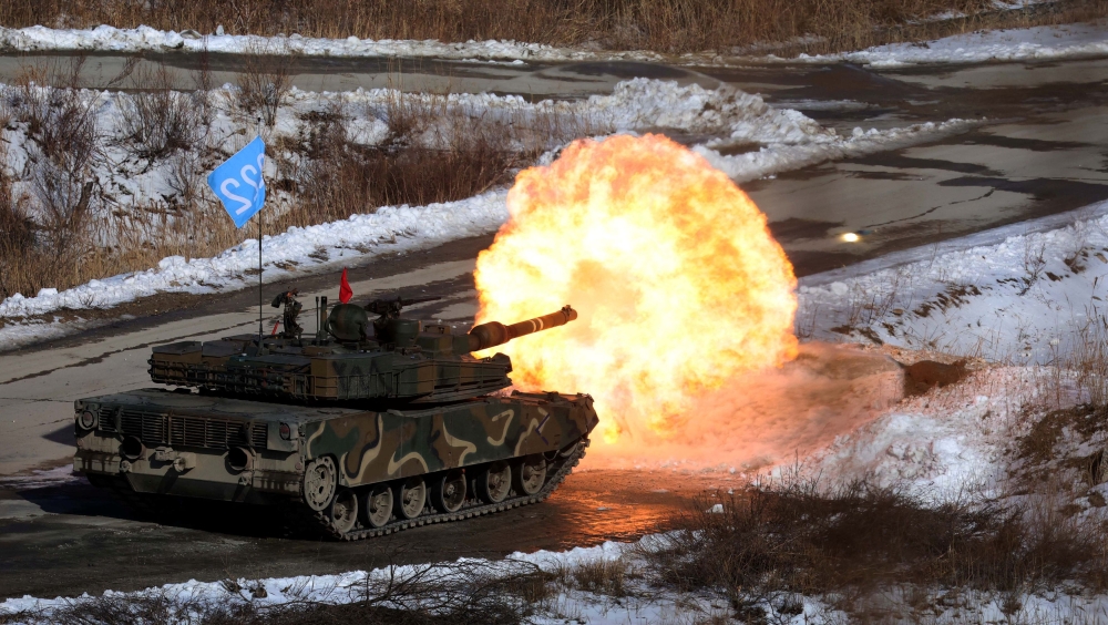A South Korean army K1A2 tank fires during a live fire exercise near the demilitarised zone separating two Koreas, in Pocheon, South Korea. — Reuters pic
