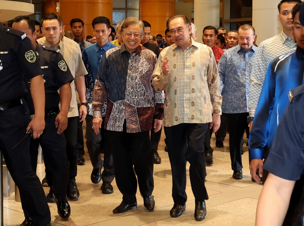 Prime Minister Datuk Seri Anwar Ibrahim accompanied by Sarawak Premier Tan Sri Abang Johari Openg at the 2025 National Financial Council Meeting at the Ministry of Finance in Putrajaya, March 6, 2025. — Bernama pic 