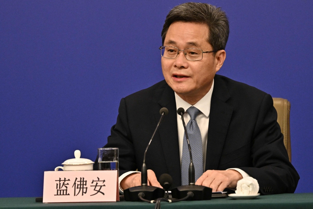 Pan Gongsheng, Governor of People’s Bank of China, attends a press conference during the second session of the 14th National People's Congress (NPC) in Beijing on March 6, 2025. — AFP pic