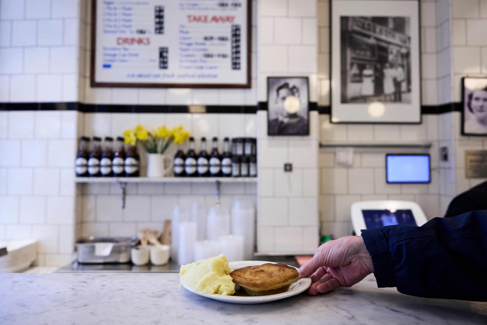 A typical portion of traditional pie and mash is served at G Kelly in east London on February 19, 2025. Now a campaign to get pie and mash special protected status is gaining ground, with supporters arguing the dish deserves an official stamp of recognition similar to Parmesan cheese and Champagne. — AFP pic