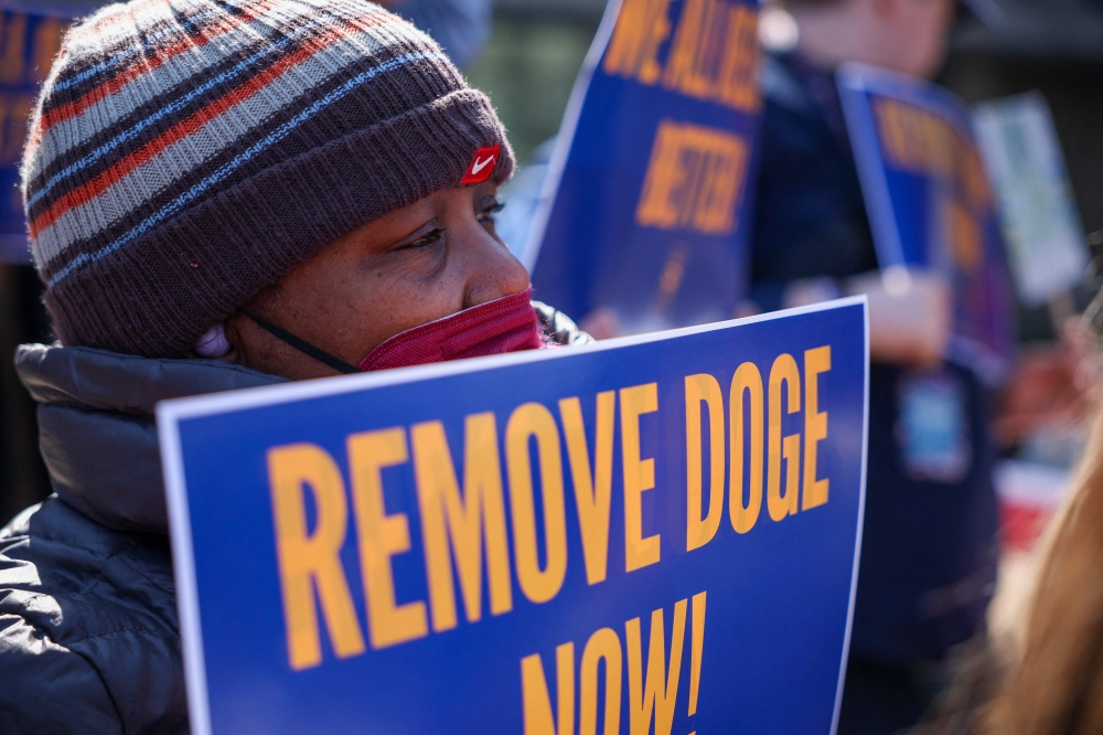 Workers gather to protest recent cuts made to the department by Elon Musk’s Department of Government Efficiency (DOGE). — AGP pic
