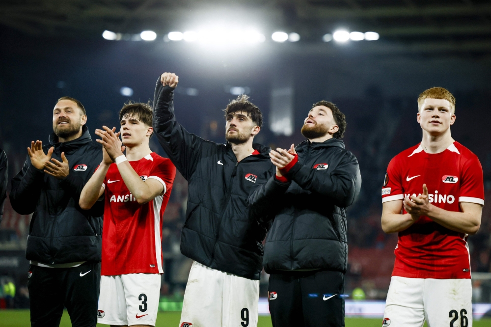 AZ Alkmaar's (L to R) Jeroen Zoet, Wouter Goes, Troy Parrott, Mees de Wit, Kees Smit celebrate their team victory at the end of the UEFA Europa League round of 16 first-leg football match between AZ Alkmaar and Tottenham Hotspur FC at AFAS stadium in Alkmaar. — AFP pic