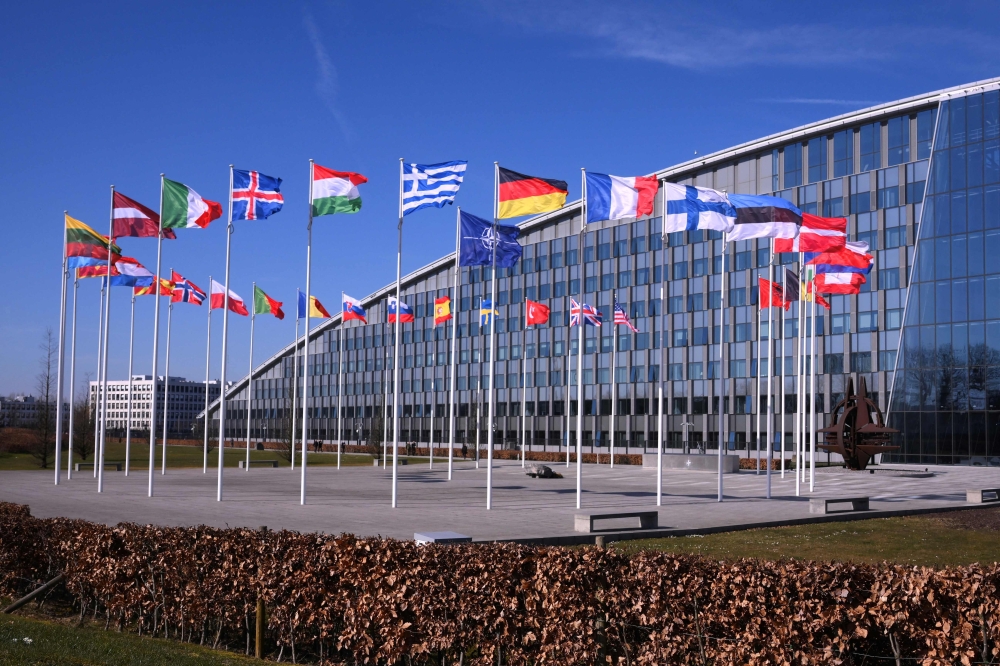 This photograph taken on March 6, 2025 shows the member nation flags in the Cour d'Honneur of the The North Atlantic Treaty Organization (NATO) headquarters in Brussels. — AFP pic