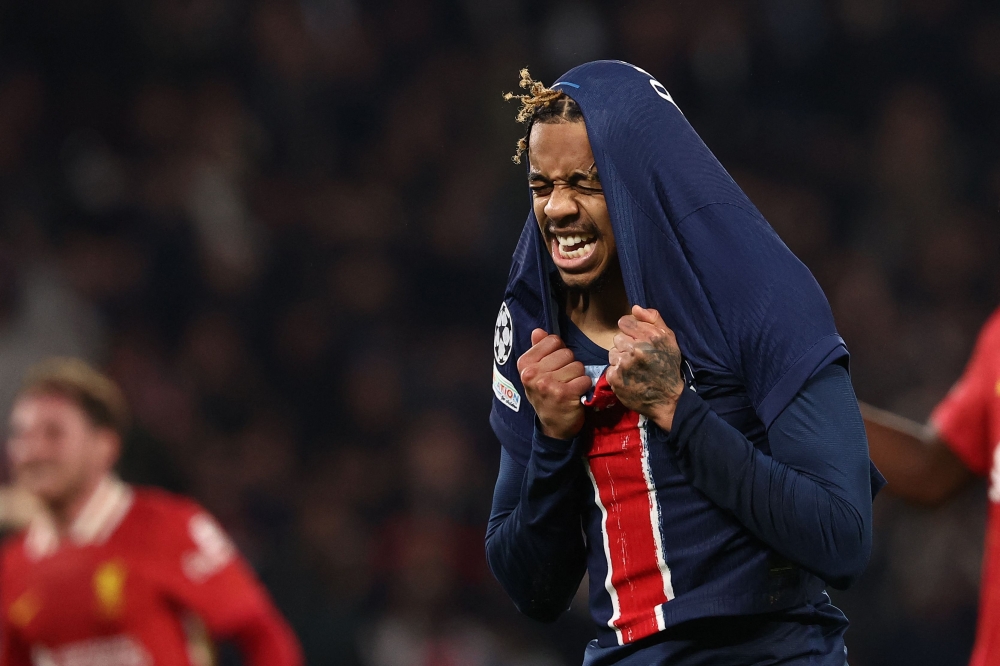 Paris Saint-Germain's forward Bradley Barcola reacts after missing a goal scoring opportunity during the UEFA Champions League Round of 16 first leg football match with Liverpool at the Parc des Princes stadium in Paris on March 5, 2025. — AFP pic