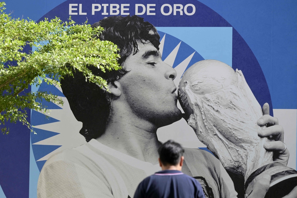 An image of late football star Diego Maradona is seen on the 2nd anniversary of his death at CONMEBOL fan zone 