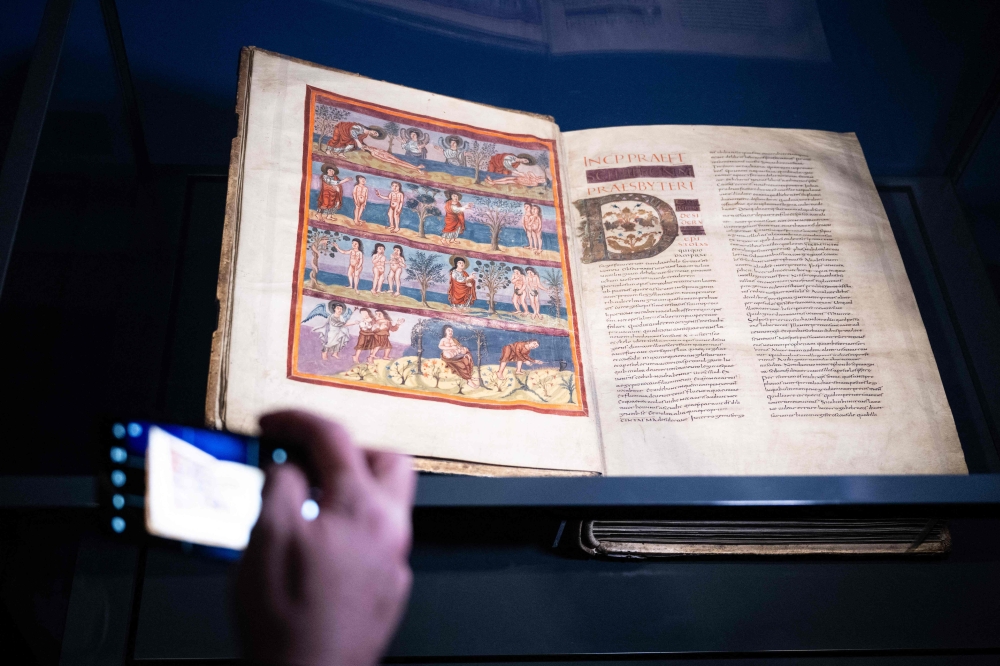 A view of the Moutier-Grandval Bible, a 9th century illustrated bible, one of the oldest fully preserved bibles in the world, during the press day for the exhibition ‘Sur les traces d’n chef-d’euvre: La Bible de Moutier-Granval’ or ‘On the trail of a masterpiece’ at the Mus’ jurassien d’rt et d’istoire (MJAH), in Delemont, the capital of the Swiss canton of Jura on February 6, 2025. — AFP pic