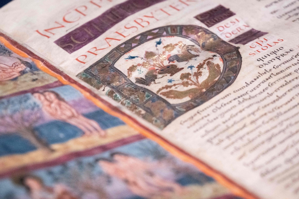 A detailed view of the Moutier-Grandval Bible, a 9th century illustrated bible, one of the oldest fully preserved bibles in the world, during the press day for the exhibition ‘Sur les traces d’n chef-d’euvre: La Bible de Moutier-Granval’ or ‘On the trail of a masterpiece’ at the Mus’ jurassien d’rt et d’istoire (MJAH), in Delemont, the capital of the Swiss canton of Jura on February 6, 2025. — AFP pic