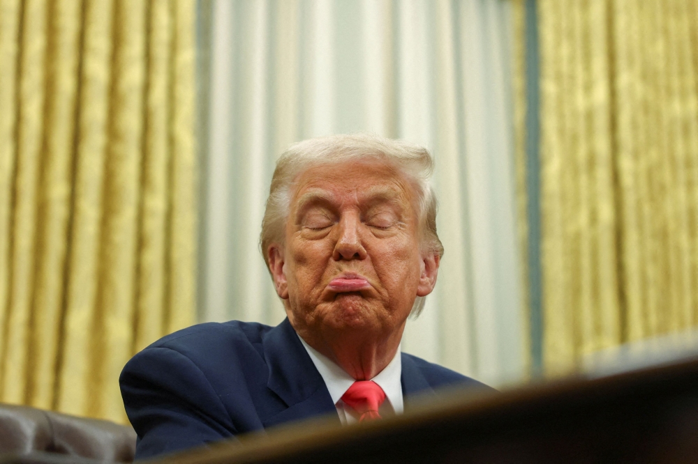 US President Donald Trump reacts in the Oval Office, at the White House in Washington, D.C. March 6, 2025. — Reuters pic