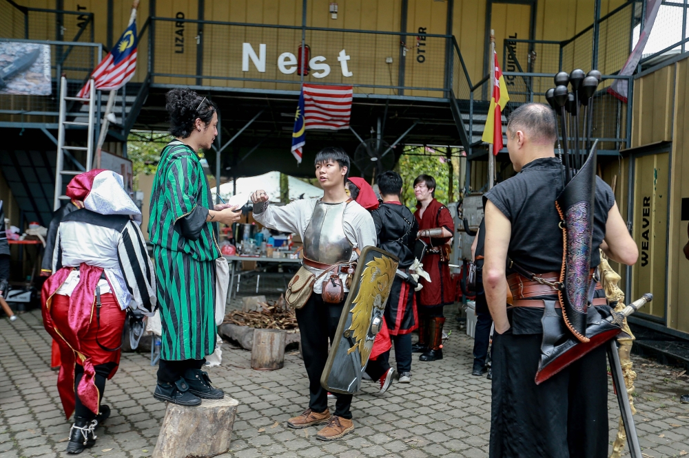 Alvin (centre) together with other LARP participants, fully embraces the world of Maelstrom. — Picture by Sayuti Zainudin