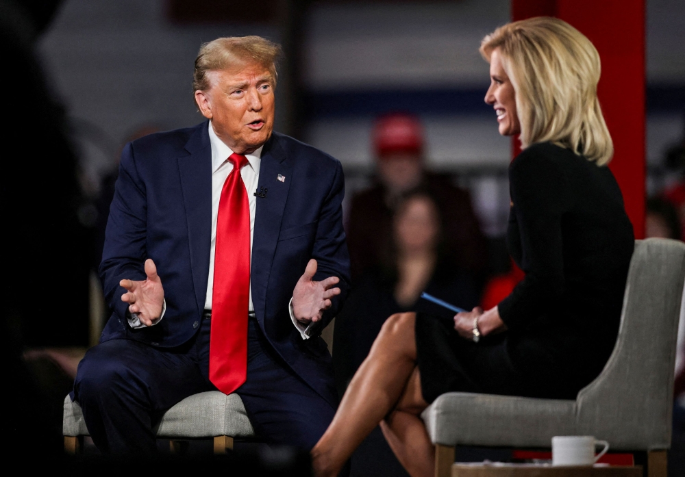 Former US President and Republican presidential candidate Donald Trump participates in a Fox News town  hall with Laura Ingraham in Greenville, South Carolina, US February 20, 2024.  — Reuters pic