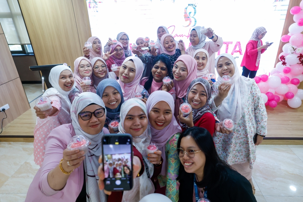 Members of the Bernama Women’s Association pose for a group photo during the Women’s Day celebration themed 'Women with Aspirations, Building a Legacy' at Dewan Bernama. — Bernama pic