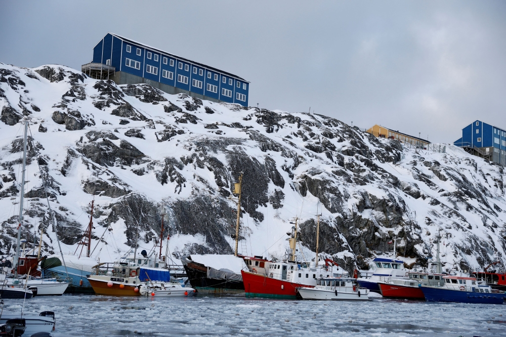 Fishing boats are anchored in Nuuk port, Greenland, February 5, 2025. Along with defence and shipping, extracting Greenland's deposits of uranium, lithium and rare earths on a much larger scale has drawn renewed interest from global powers to the island, most of which is covered in a gigantic ice sheet, has few roads and is battered by unforgiving weather. — Reuters pic