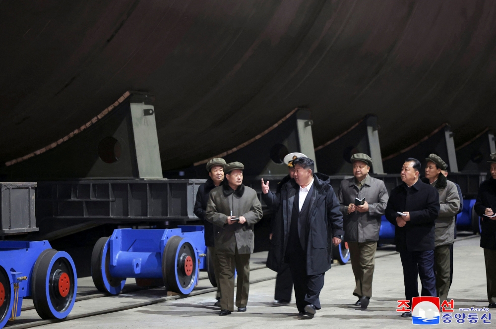 North Korean leader Kim Jong-un inspected a project to build a nuclear-powered submarine, state media reported Saturday. — AFP pic/KCNA via KNS