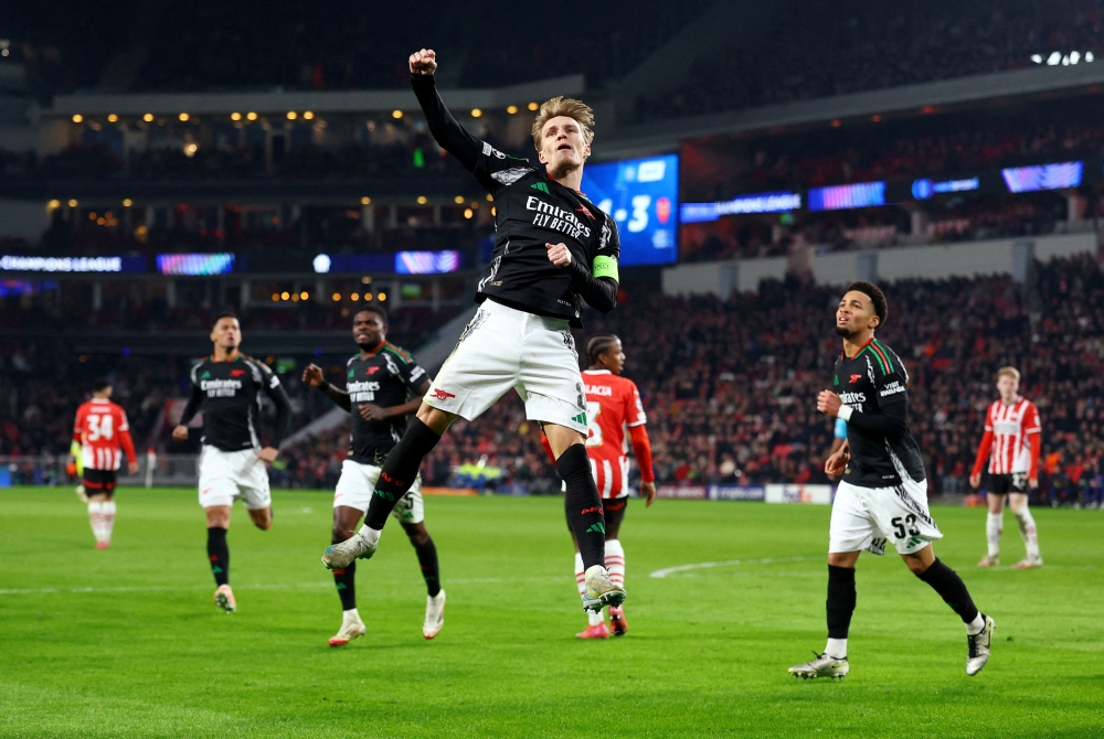 Arsenal’s Martin Odegaard celebrates scoring their fourth goal with Arsenal’s Ethan Nwaneri against PSV Eindhoven at Philips Stadion, Eindhoven, Netherlands, March 4, 2025. — Reuters pic 