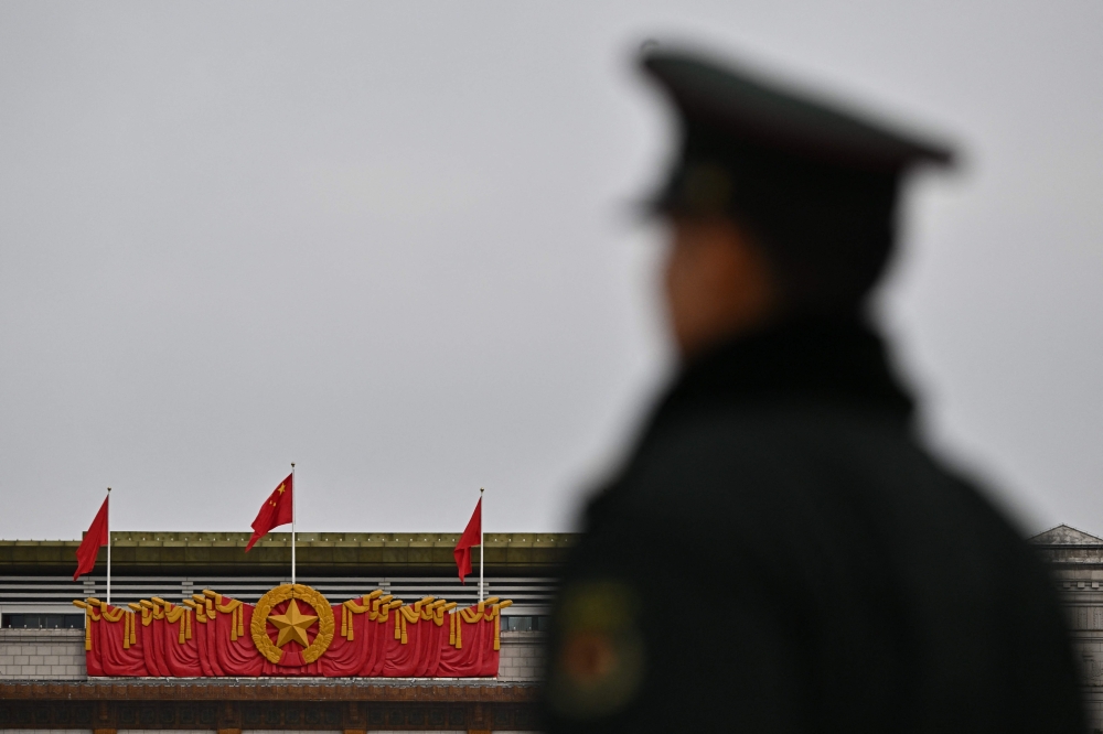 A Chinese People’s Liberation Army (PLA) soldier stands guard in front of the National Museum of China in Beijing on March 3, 2025, ahead of the country’s annual legislative meetings known as the ‘Two Sessions’. — AFP pic 