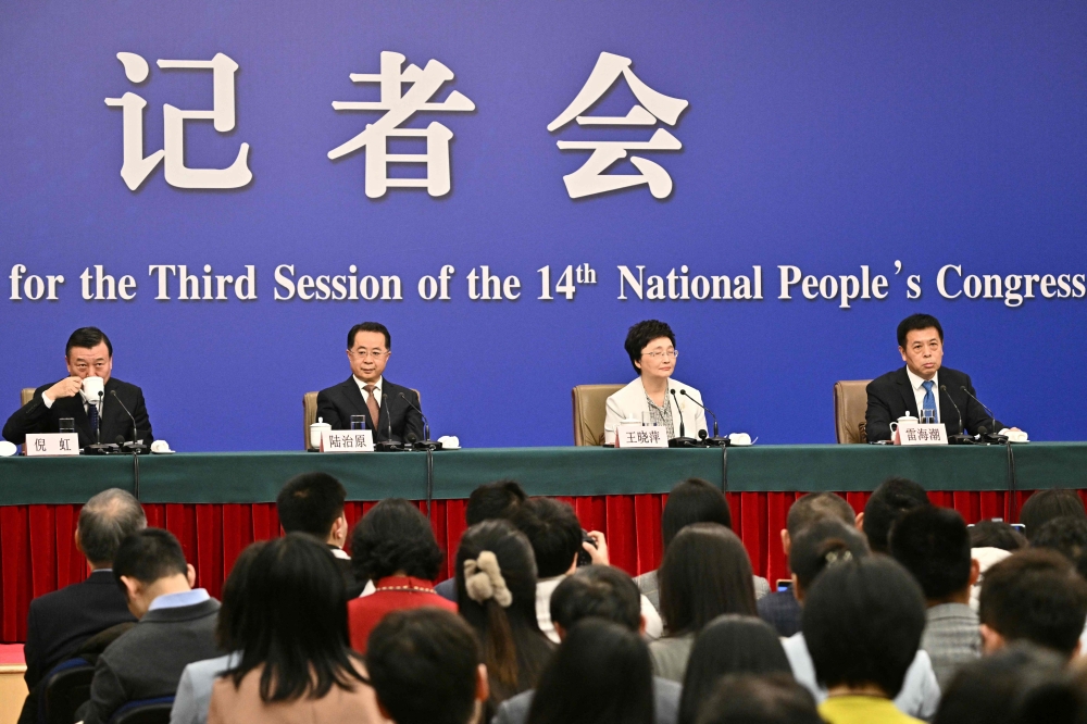 (From left) China’s Minister of Housing and Urban-Rural Development Ni Hong, Minister of Civil Affairs Lu Zhiyuan, Minister of Human Resources and Social Security Wang Xiaoping, and Director of the National Health Commission Lei Haichao attend a press conference during the ongoing National People’s Congress (NPC) in Beijing on March 9, 2025. — AFP pic 