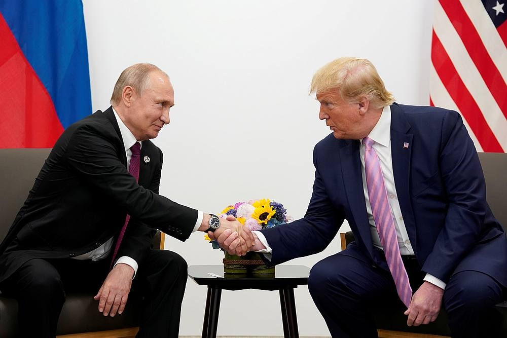 Russia's President Vladimir Putin and US President Donald Trump shake hands during a bilateral meeting at the G20 leaders summit in Osaka, Japan June 28, 2019. — Reuters pic