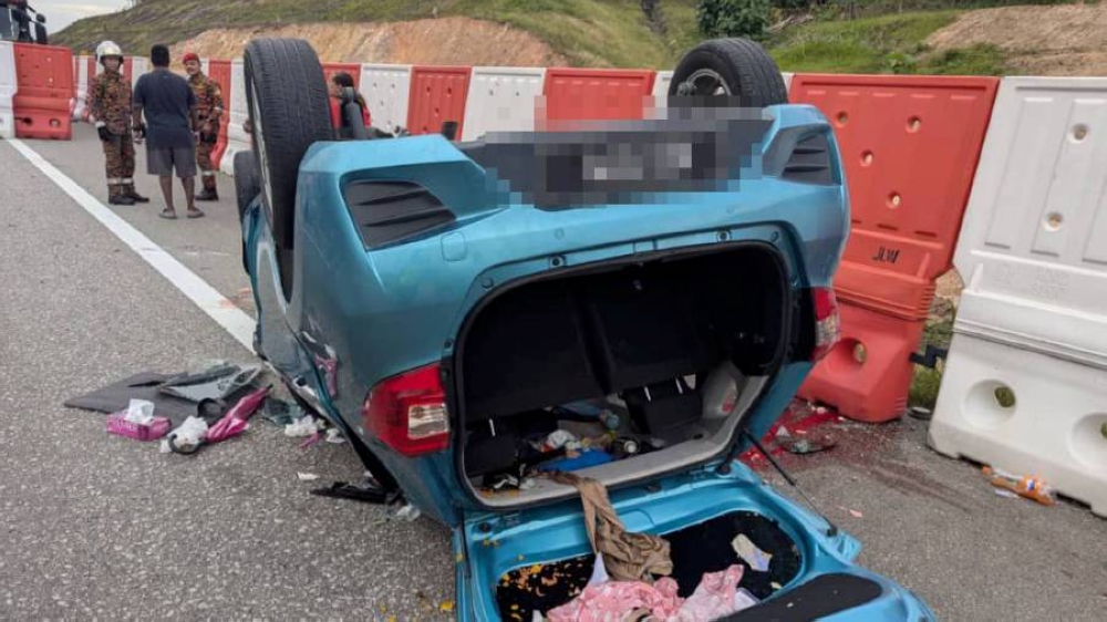 A woman was killed and her husband and two children injured when they Perodua Myvi they were travelling in was involved in a crash on the North-South Expressway. — Picture via Facebook