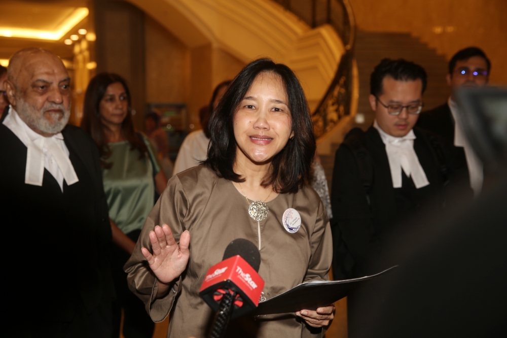 ⁠Adlyn Adam Teoh, the president of Family Frontiers, held a press conference at the Federal Court in Putrajaya today after reaching a settlement with the government. — Picture by Choo Choy May 