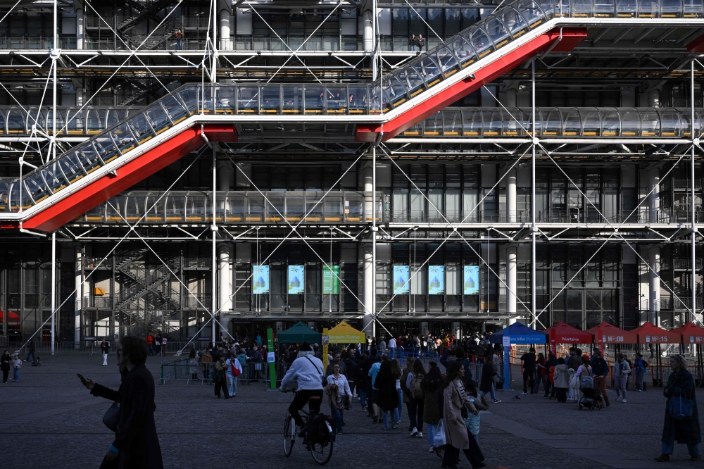 Visitors queue outside the Centre national d’art et de culture Georges-Pompidou (Centre Pompidou) in Paris on March 8, 2025. — AFP pic 