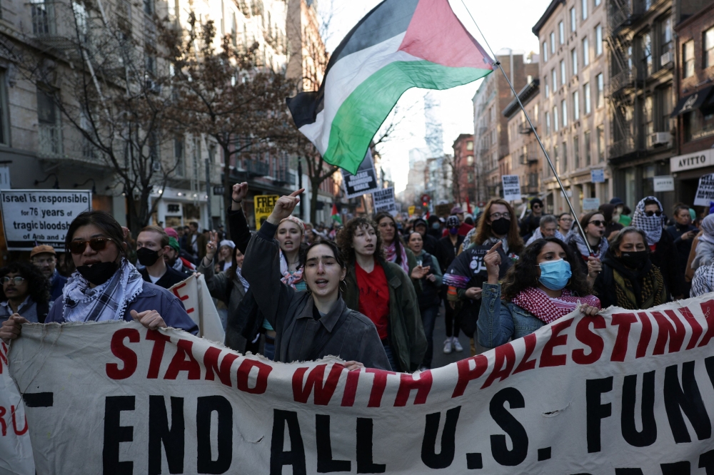 Demonstrators hold a banner as they march during a protest following the arrest by US immigration agents of Palestinian student protester Mahmoud Khalil at Columbia University, in New York City, U.S., March 10, 2025. — Reuters pic