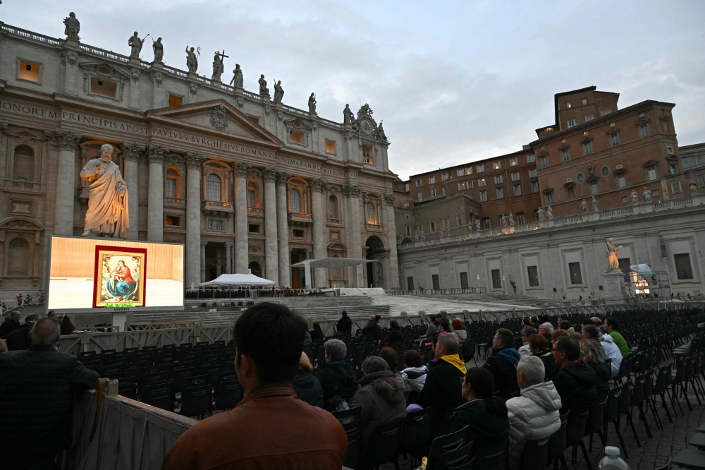 People attend rosary prayers for Pope Francis who is still hospitalized with pneumonia, in The Vatican on March 10, 2025. — AFP pic