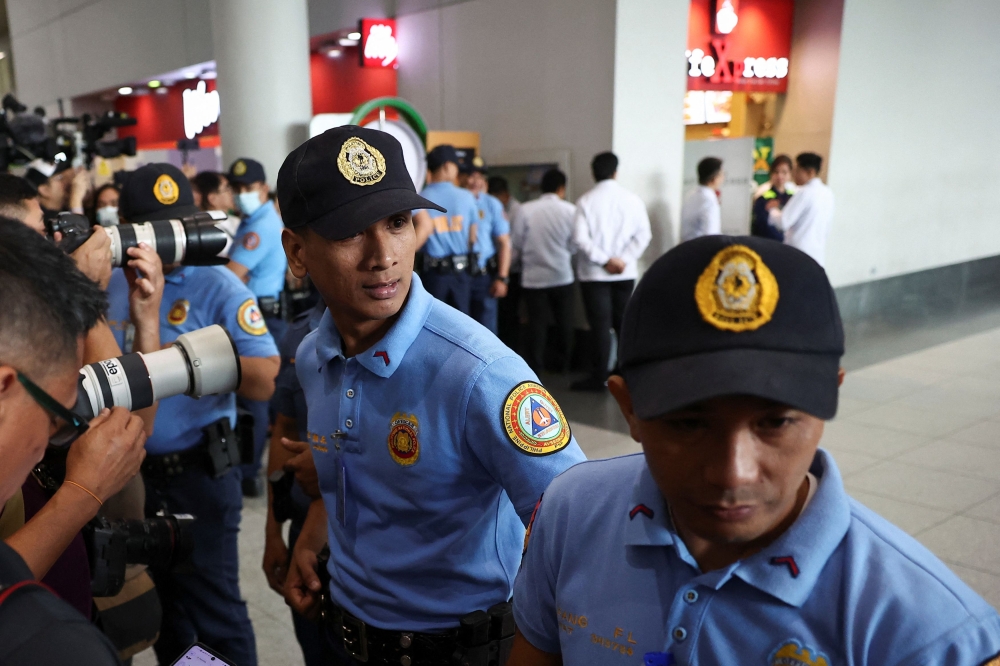 Police and media standby for the arrival of former Philippine President Rodrigo Duterte from Hong Kong, at the Ninoy Aquino International Airport in Pasay City, Metro Manila, Philippines, March 11, 2025.  — Reuters pic