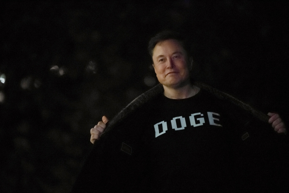 Senior Advisor to the President of the United States Elon Musk shows his shirt to the press as he arrives with US President Donald Trump on the South Lawn of the White House in Washington, DC, US March 9, 2025. — Reuters pic 
