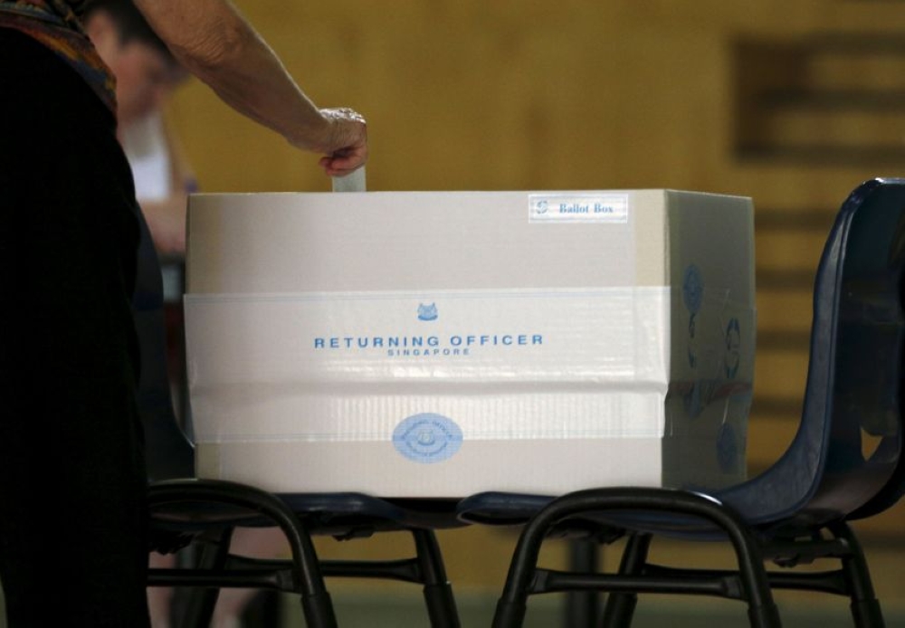 File picture of a voter casting his ballot during the general election at a polling centre in Singapore September 11, 2015. Singapore must hold elections by November 2025, although the prime minister can call for earlier polls. The vote will be the first electoral test for Prime Minister Lawrence Wong, who took over from long-time premier Lee Hsien Loong as leader of the People’s Action Party in May 2024. — Reuters pic