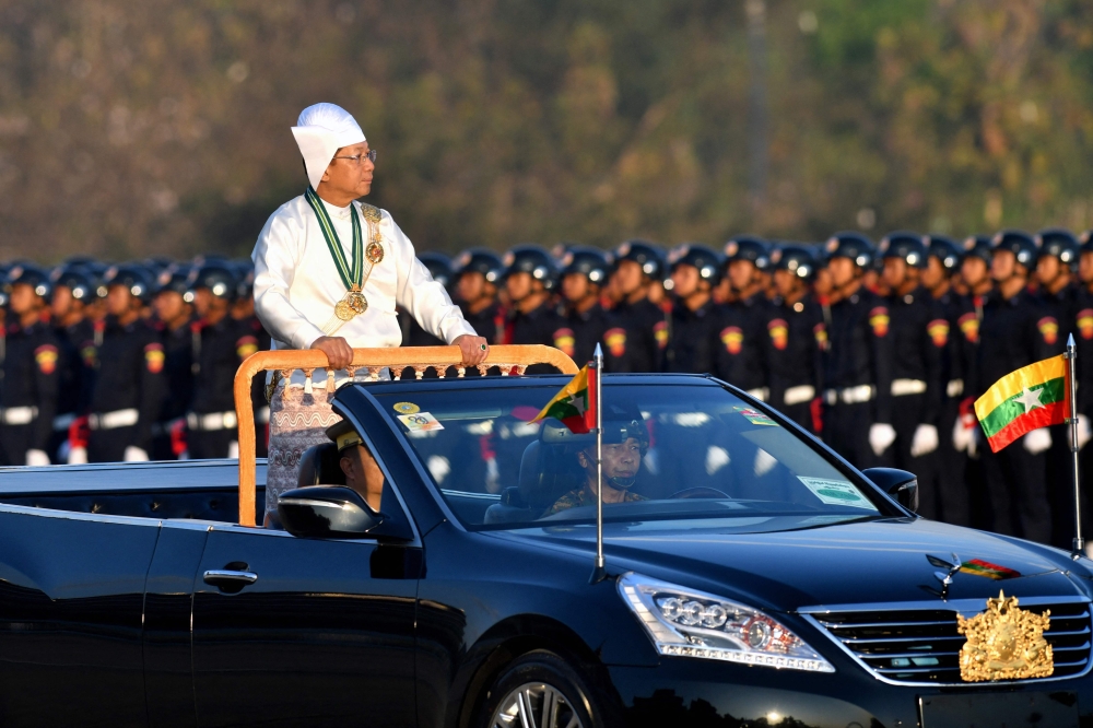 Myanmar’s military chief Min Aung Hlaing stands in a car as he oversees a military display at a parade ground to mark the country’s Independence Day in Naypyidaw on January 4, 2023. Myanmar’s military junta has announced plans for elections in December 2025 or January 2026 — scheduling the first poll since it seized power in a bloody 2021 coup that plunged the country into civil war. — AFP pic 