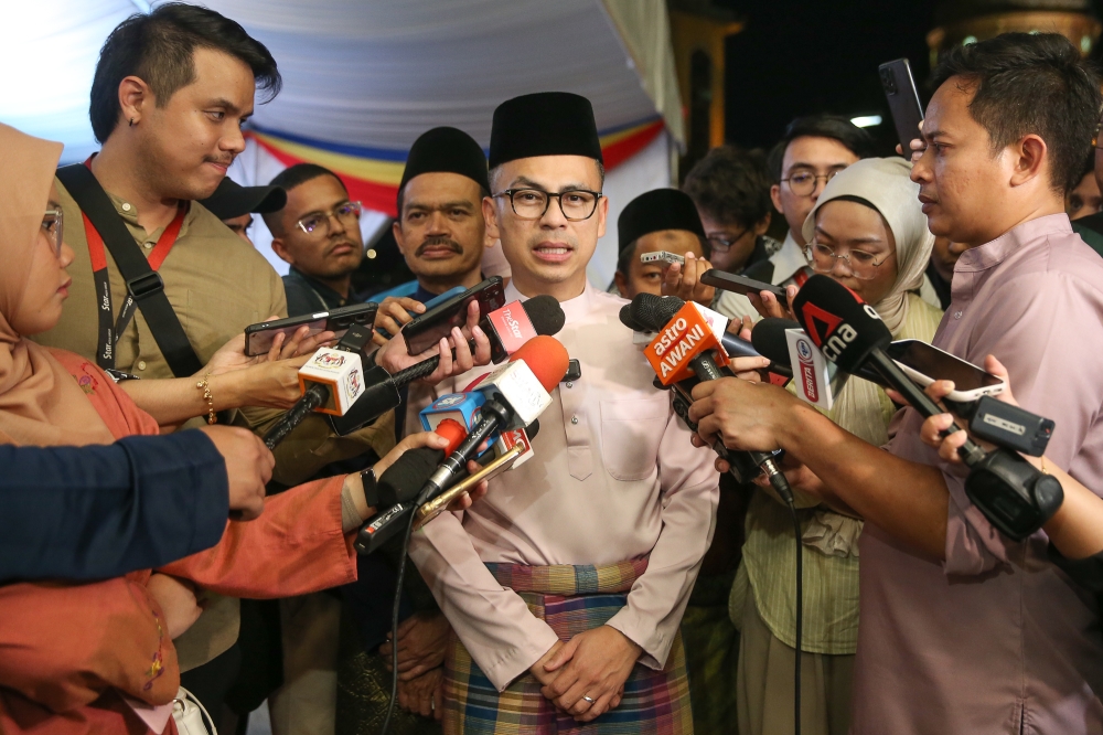 Communications Minister Datuk Fahmi Fadzil speaks to reporters during a breaking of fast event with media at Angkasapuri in Kuala Lumpur March 11, 2025. — Picture by Yusof Mat Isa