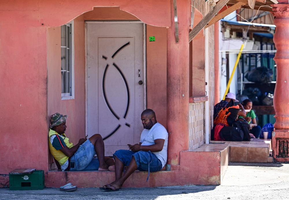 Migrants bound for Colombia wait for a boat in Miramar, near Palenque, Panama, on March 5. — AFP pic