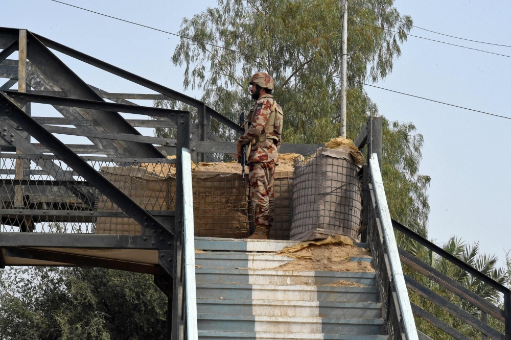 A paramilitary soldier stands guard at a railway station in the Sibi district of southwestern Balochistan province. — AFP pic