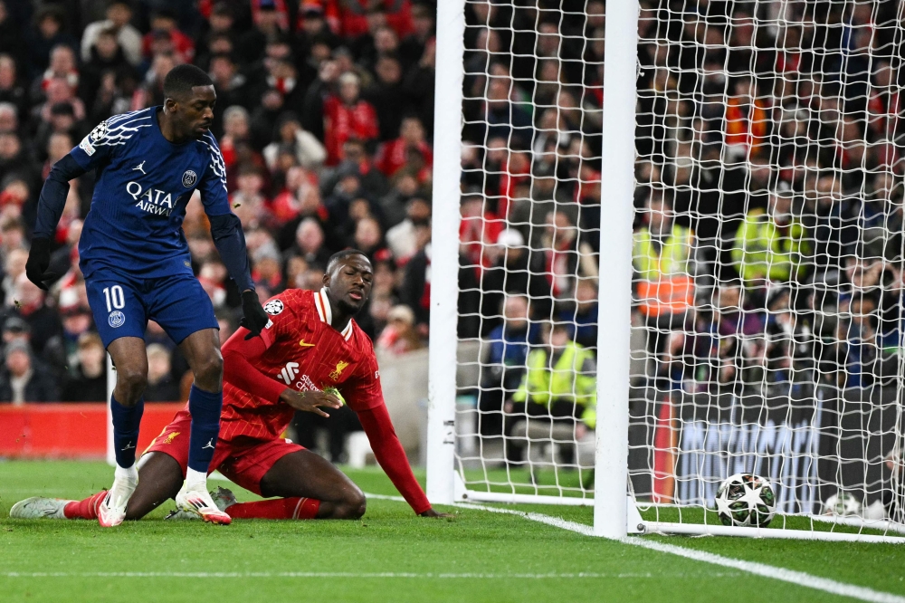 Paris Saint-Germain’s Ousmane Dembele shoots and scores his team first goal during the last 16 second leg Uefa Champions League football match between Liverpool and Paris Saint-Germain (PSG) at Anfield in Liverpool, March 11, 2025. — AFP pic 