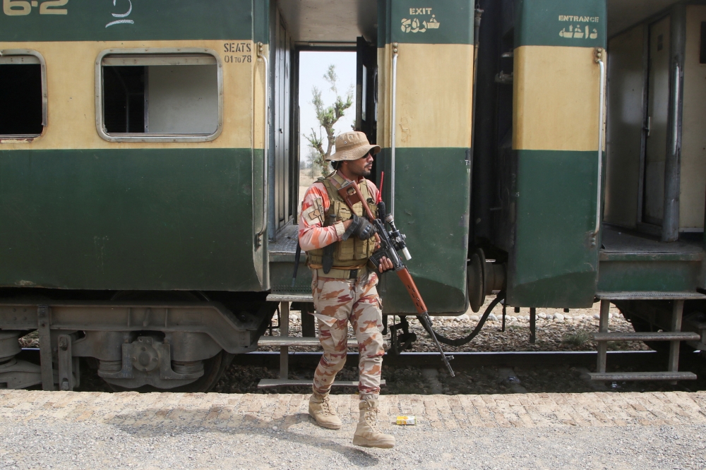 A Pakistan Army soldier stands guard next to a rescue train, after the attack on a train by separatist militants in Bolan, at the railway station in Mushkaf, Balochistan, Pakistan, March 12, 2025. — Reuters pic 