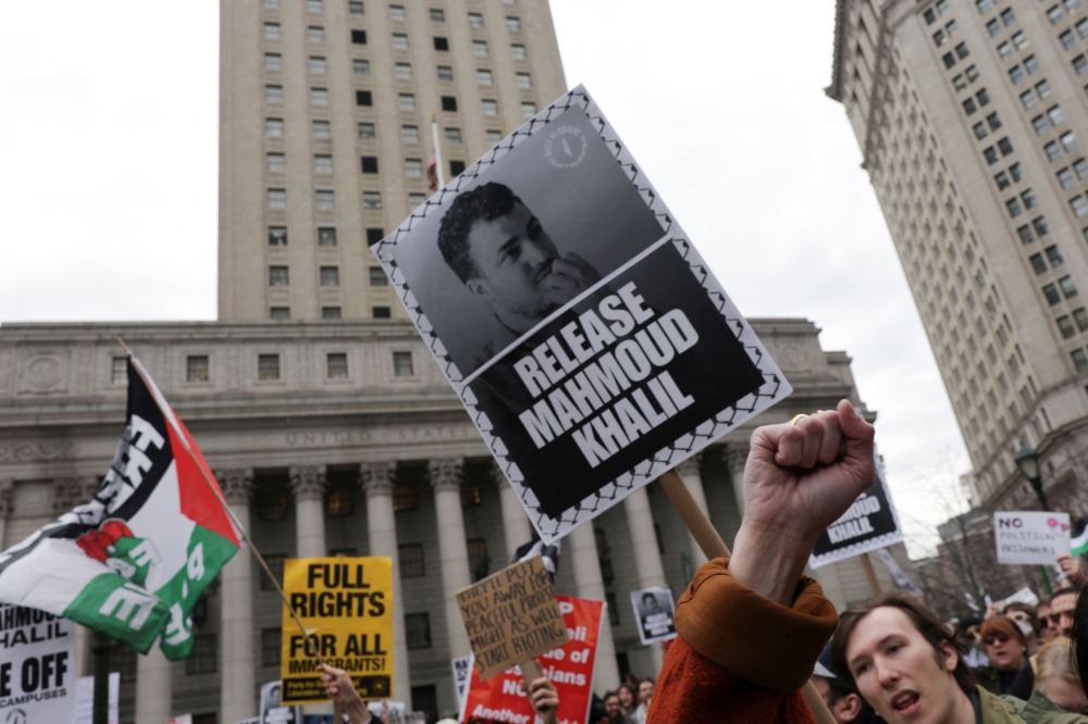 Demonstrators hold placards as they protest on the day of a hearing on the detention of Palestinian activist and Columbia University graduate student Mahmoud Khalil, in New York City, March 12, 2025. — Reuters pic 
