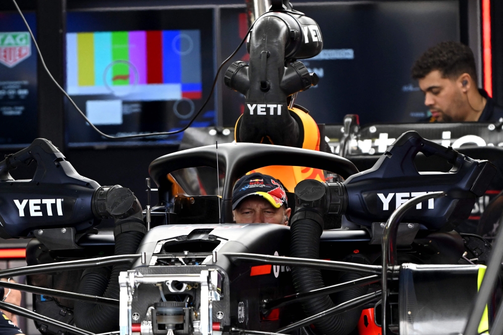 Mechanics work on the car of Red Bull Racing’s Dutch driver Max Verstappen at the Albert Park circuit in Melbourne on March 13, 2025, ahead of the Formula One Australian Grand Prix. — AFP pic 