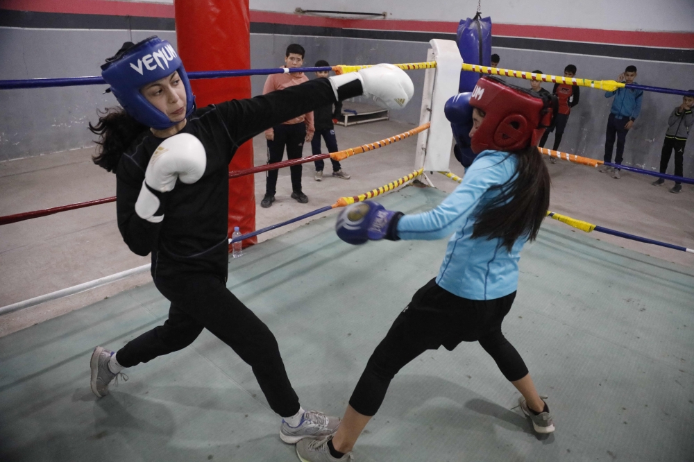 Young Algerian women practice in the boxing ring at a club in Azazga town in Algeria’s Tizi Ouzou province on February 25, 2025. — AFP pic 