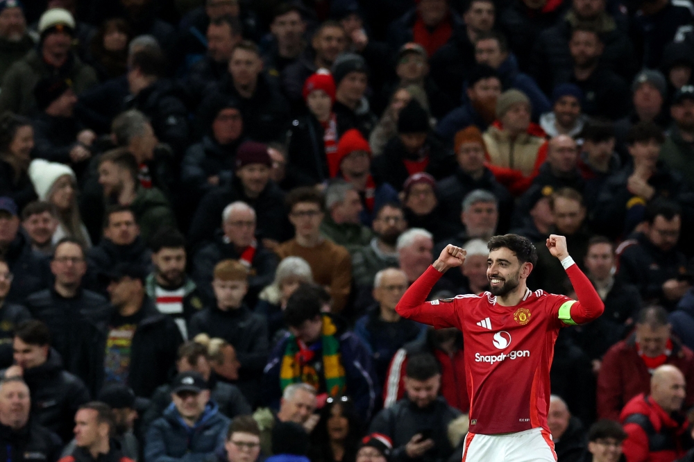 Manchester United's Portuguese midfielder Bruno Fernandes celebrates scoring the team's second goal from the penalty spot during the UEFA Europa League Last 16 today. — AFP pic